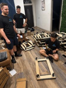 College Movers crew assembling furniture