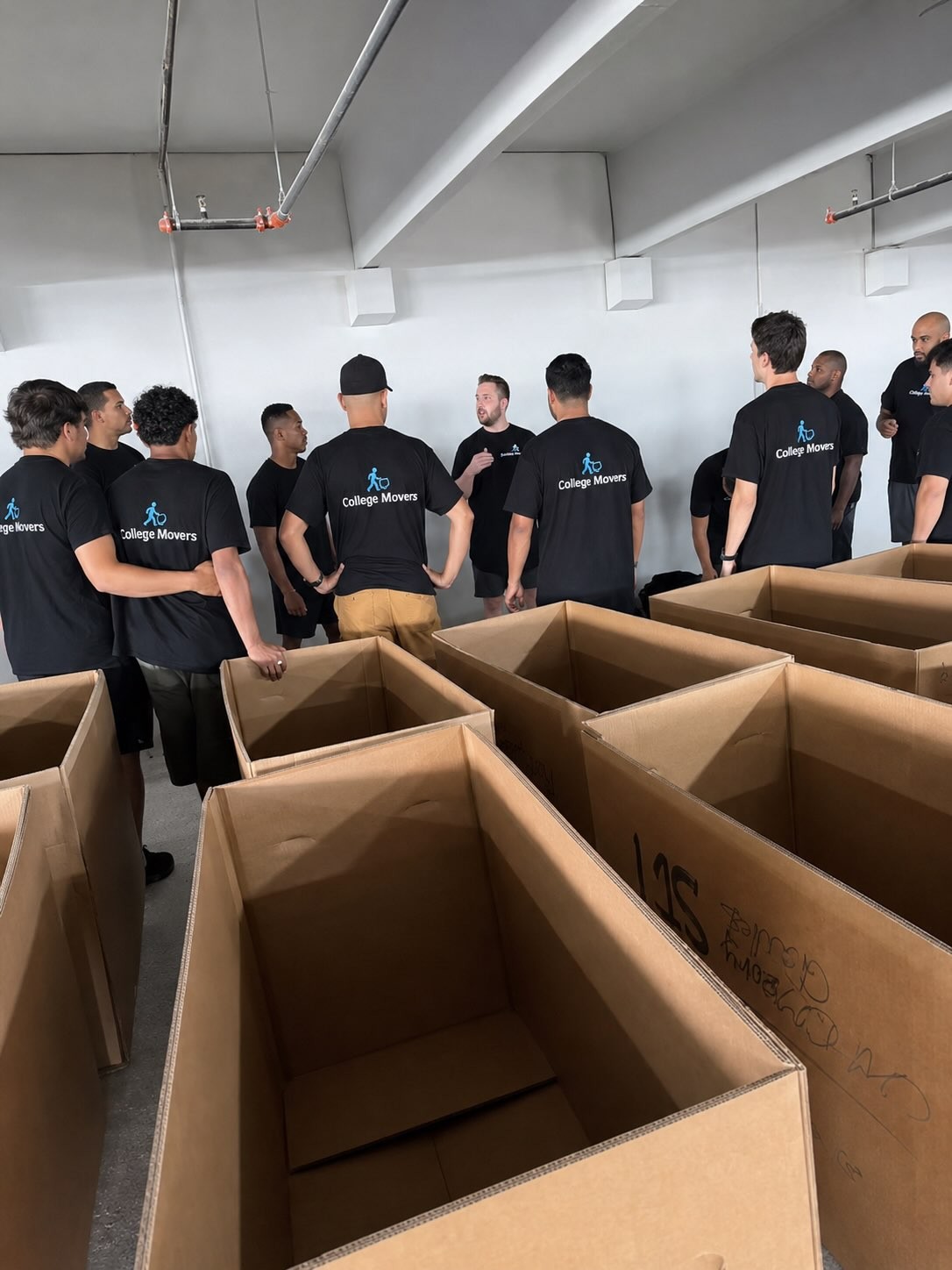 College Movers crew moving reusable bins