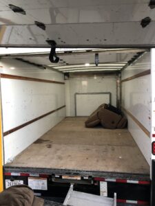 Furniture and moving dolly secured inside a truck