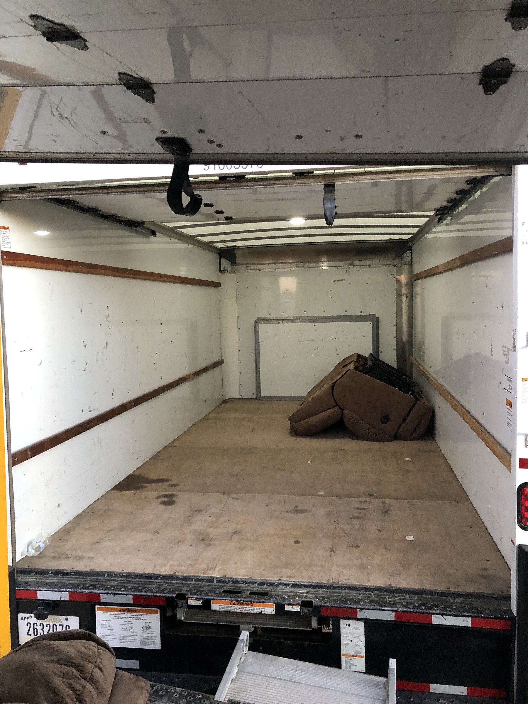 Furniture and moving dolly secured inside a truck