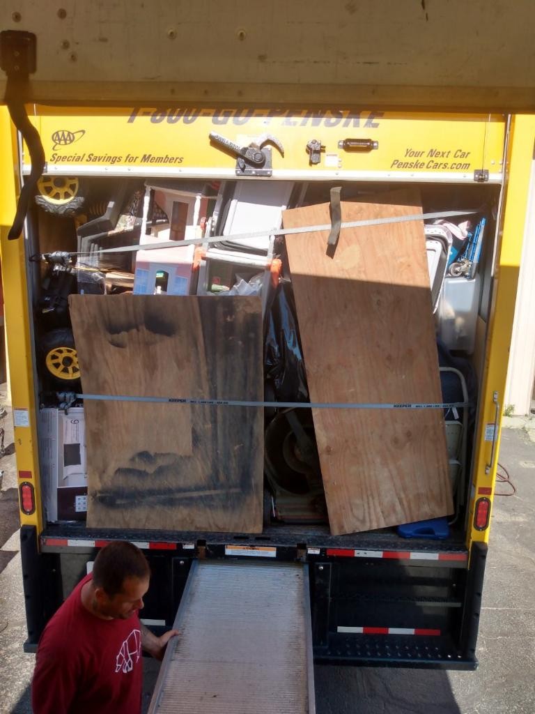 College Movers loading large furniture