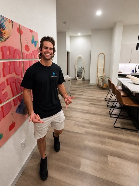 College Movers team member working inside an apartment