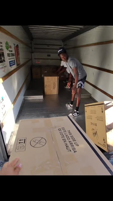 College Movers team member inside a moving truck