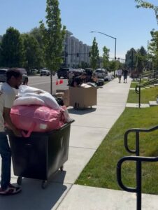 College Movers moving bin on a college campus