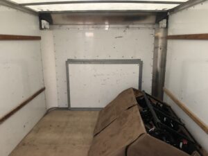 Nearly empty moving truck after College Movers unloading service