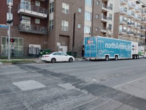 College Movers truck parked at an apartment community