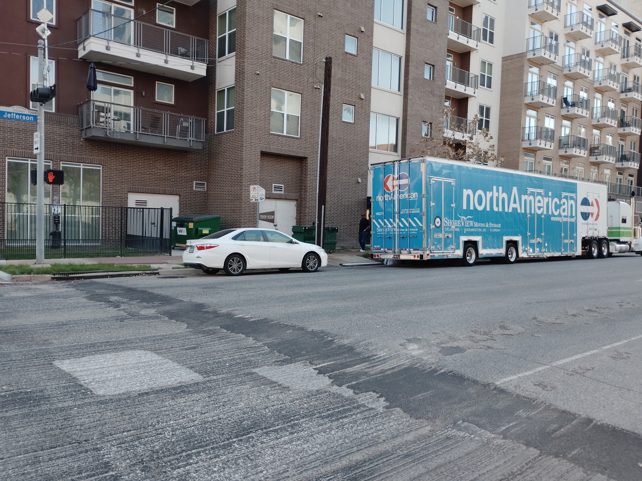 College Movers truck parked at an apartment community